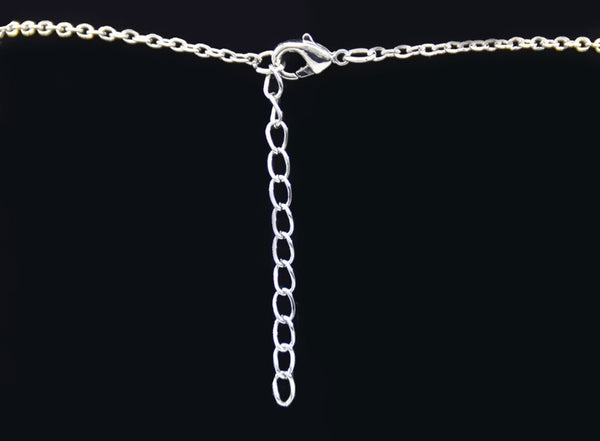 Collier pendentif aux 2 fers à cheval ornés de zircons noir et blanc