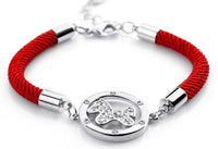 Bracelet médaillon cheval, corde rouge, plaqué or et brillants_